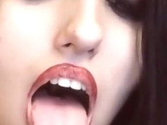Sexy goth girl opens mouth wide