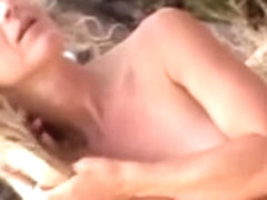 Handjob sex with a naked bitch on a public beach