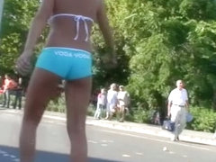 Street candid teen blonde girl in turquoise short pants