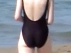 Hot housewife is wearing black candid swimsuit on beach 07y