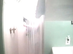 Sexy sporty girl gets caught in a shower by a hidden cam