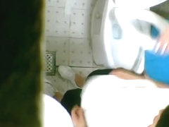 One girl pissing on toilet after another on the spy cam