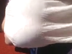 Watch thru white suit showing pink belt