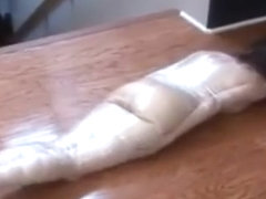 Plasticwrapped mummified girl