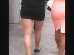 Woman in pantyhose, mini skirt and high heels