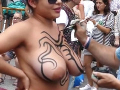 Latina gets bodypaint on her huge tits