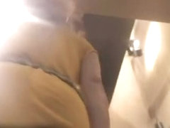 Tall blonde in yellow dress upksirt voyeur video