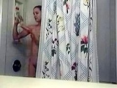Girl gets filmed while showering
