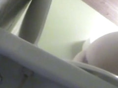 The sexy booty of pissing girl is shot on the toilet cam