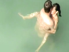 Nudist sex in the water