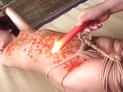 Sexy Japanese girl bounded and covered in wax