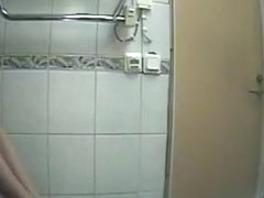 Girl in black clothes pees in toilet