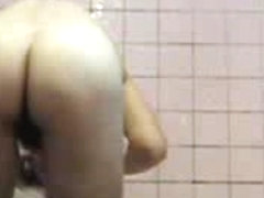 Old woman caught in the shower on a hidden camera