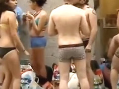 Spain students wearing only underwear wait in front of the shop for it to open