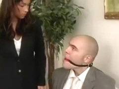 men in suit ball-gagged