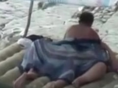 Amateur couple is having sex on the beach
