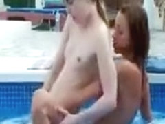 Lesbian teen couple making out in pool