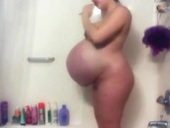 Huge pregnant belly in shower