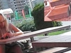 Sexy sitting upskirt in a street cafe