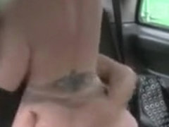 Huge tits tattooed blonde fucking in fake taxi