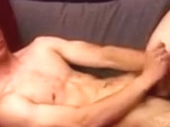 Hunky guy jerks off and plays with a dildo