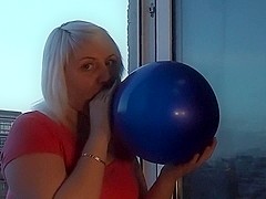 Emily Addison blow blue balloon