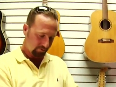 Dark haired chick is fucked in a musical shop