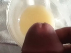 Slow Motion cum into cup full of cum