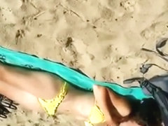 Cumming to a sleeping bikini girl on the beach