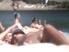 Brunette nudist woman sunbathing