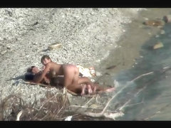 Couple fucking on a public beach, while walking past people