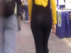 Black thong visible underneath pants