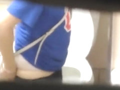 Brunette woman spied in public toilet pissing