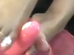 Close Up Foot Job With A Pink Dildo