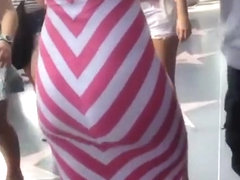 Big ass woman in tight white and pink dress