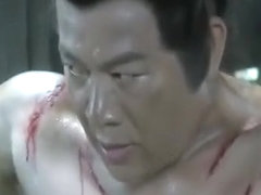 Shirtless muscular Chinese man being whipped