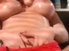 Redhead slut works big tits in the gym
