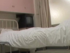 Japanese nurse was making a bed when man sharked her bottom