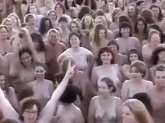 Hundreds of nudists strip for a camera man