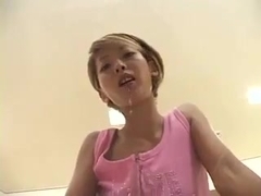 beautiful Japanese girl spitting on the table