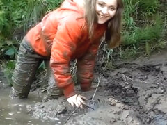 Three Girls in Mud in Winter Clothes