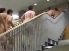 Bunch of naked students running up the stairs