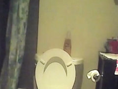 Hidden piss cam in the home toilet shows peeing sister